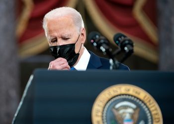 As Omicron surges, Biden shifts his message to urge Americans to learn to live with COVID